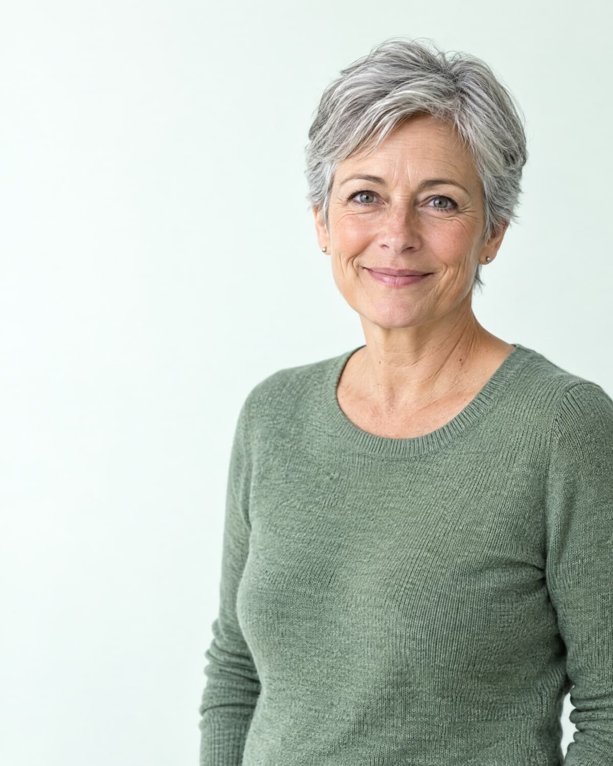 Smiling woman in her fifties with silver hair